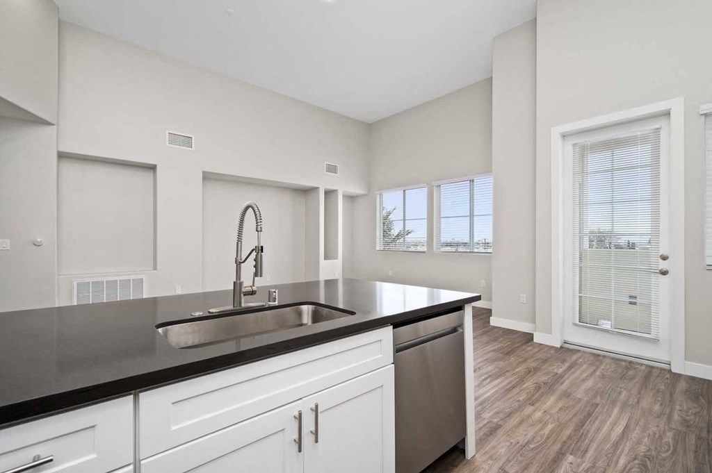 a kitchen with a sink and a window