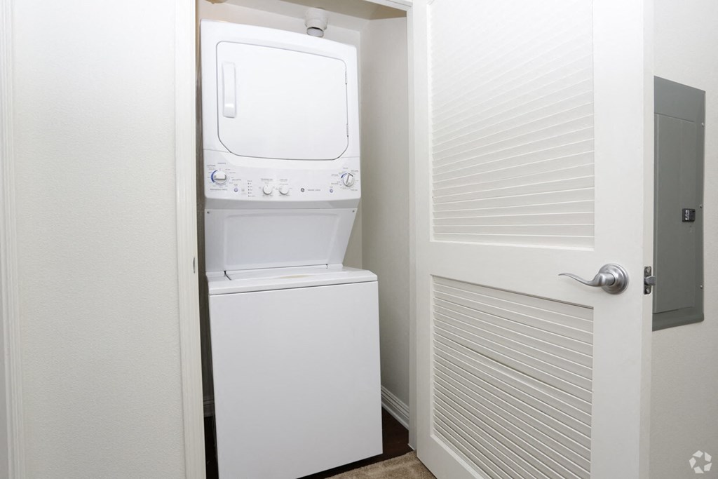 a small laundry room with a washer and dryer in a closet