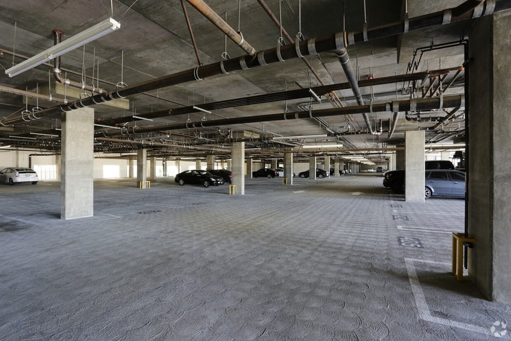 a parking garage with cars parked in it