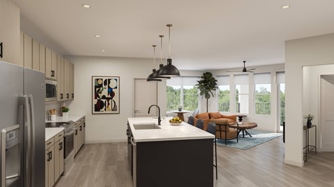 A modern kitchen with a large island and a dining area with a couch.