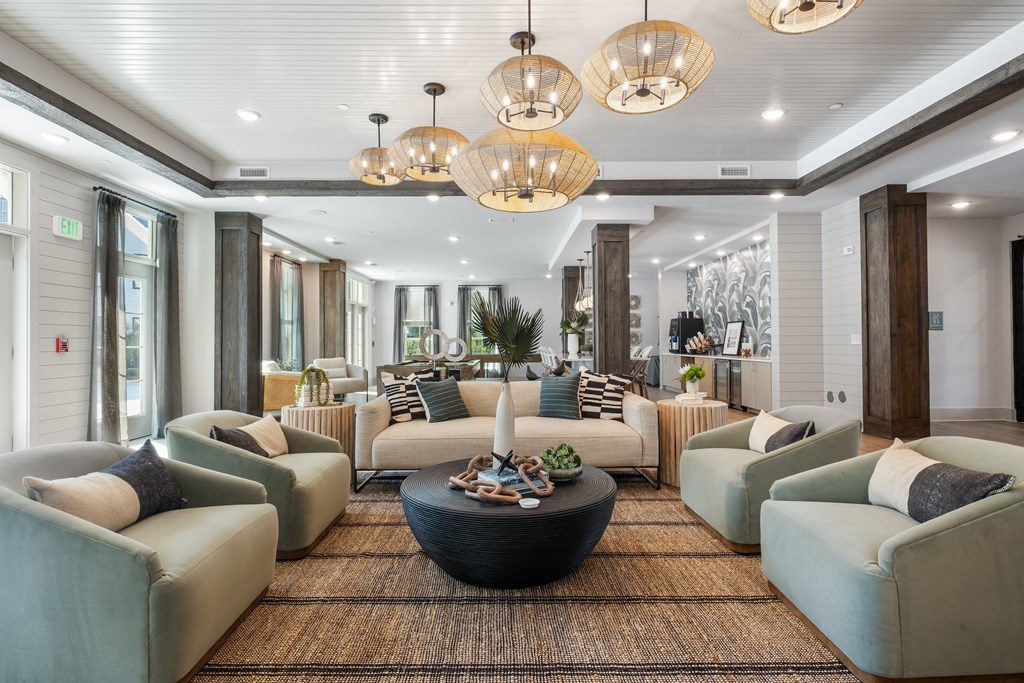 a living room with couches and chairs