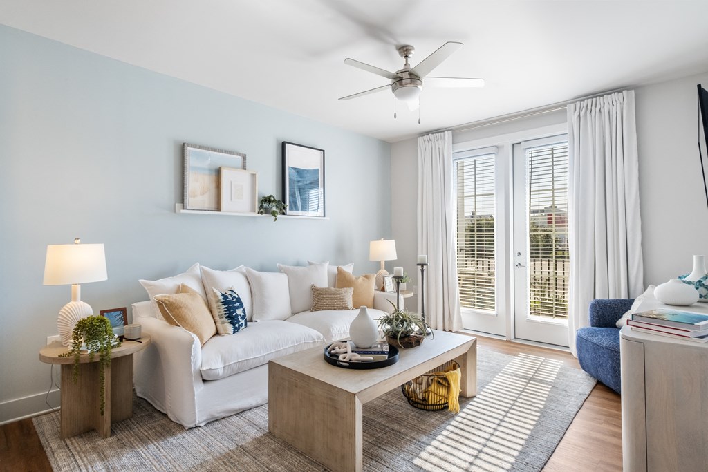 a living room with a white couch and a coffee table