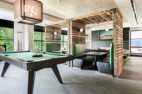 a room filled with furniture and a pool table