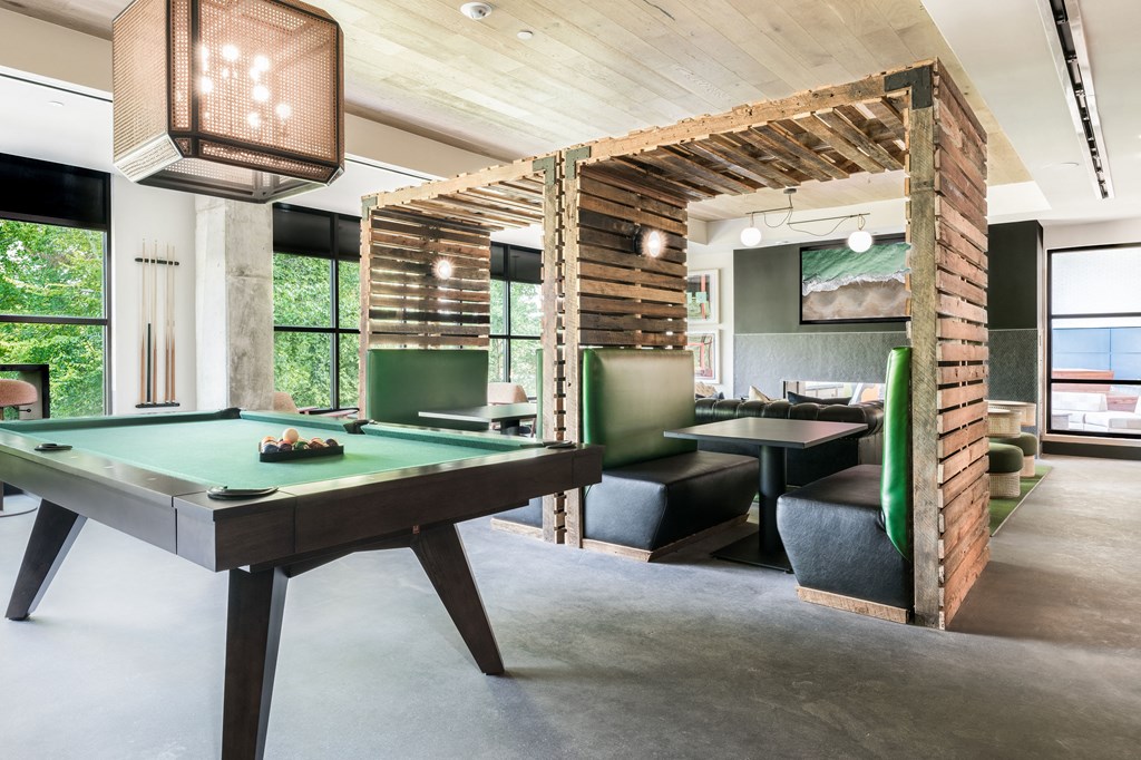 a room filled with furniture and a pool table
