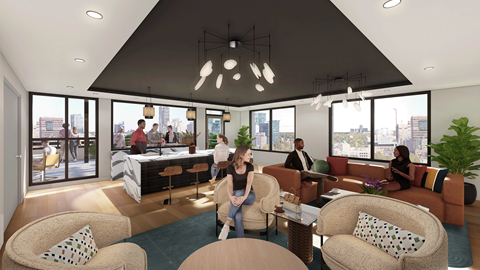 a group of people are sitting in a living room in a building with large windows