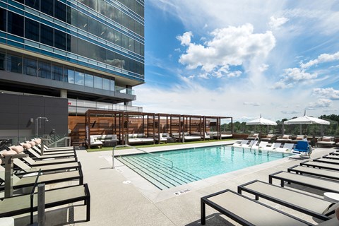 Saltwater pool featuring private cabanas