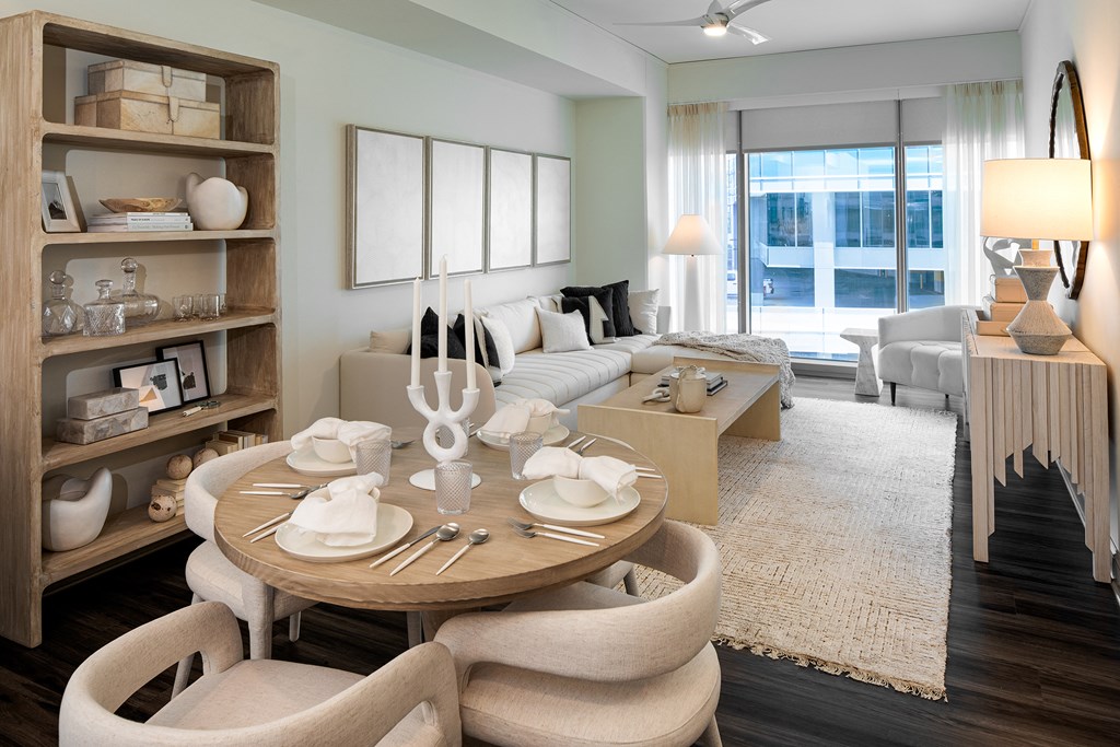 Living room with oversized windows and neutral furnishings