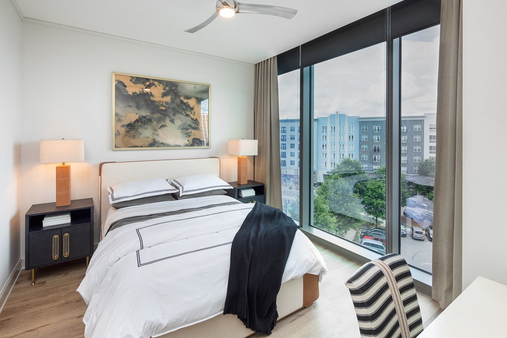 Bedrooms feature ceiling fans and blackout roller shades