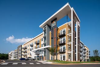 a rendering of an apartment building with a blue sky in the background