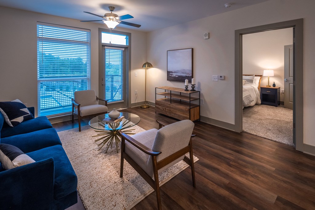 a living room with a couch chair and coffee table