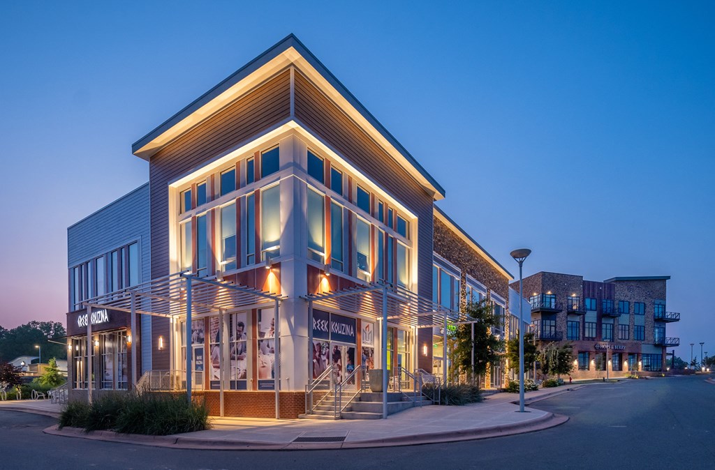 a building with lights on in the evening