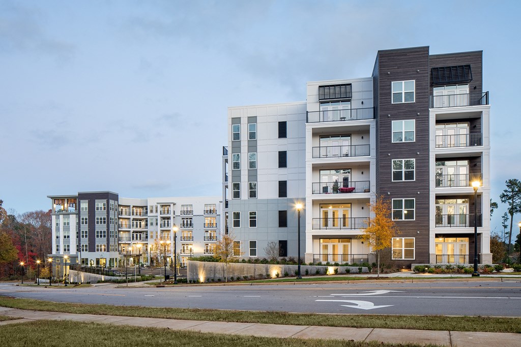 a rendering of an apartment building on a city street