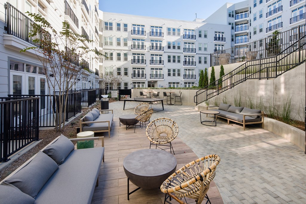 a rendering of a patio area with couches and chairs