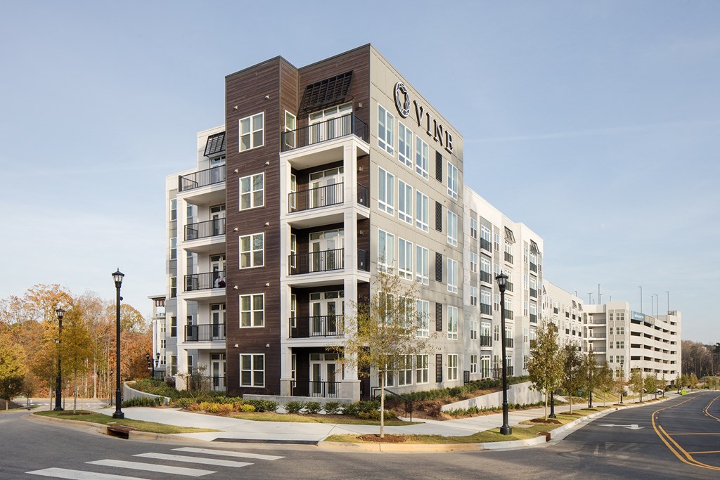 a new apartment building on the corner of a city street