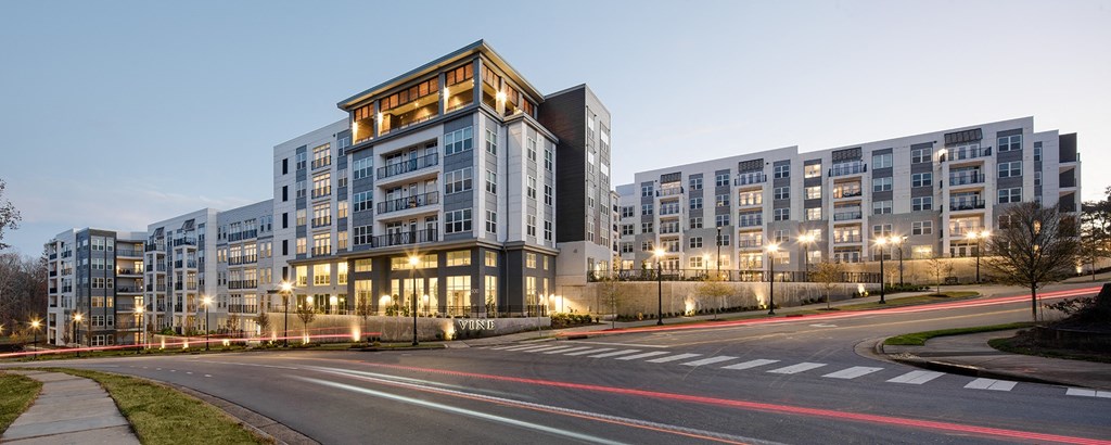 a view of a building from the side of a street