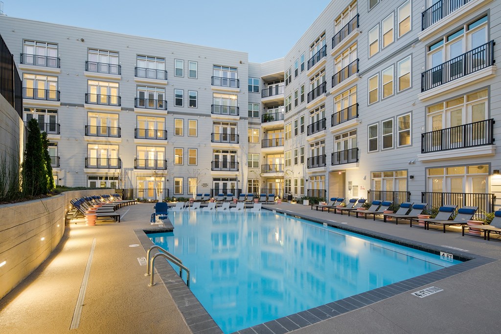 a swimming pool in front of a building