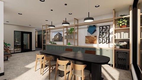 A modern kitchen with a dining table and chairs.