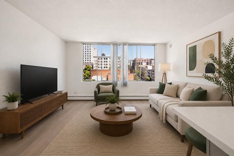 A living room with a large window overlooking a cityscape.