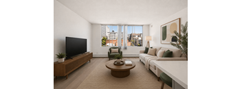 A living room with a large window overlooking a cityscape.