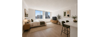 A bedroom with a large bed and a window overlooking the city.
