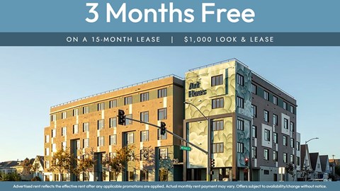 A building with a sign that says "3 Months Free on a 15-month lease | $1,000 look & lease".