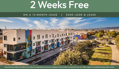 A building with a sign that says "2 Weeks Free on a 12-month lease | $500 look & lease".