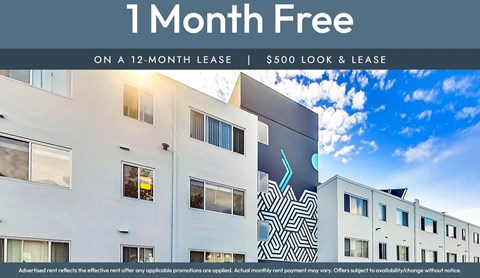 A modern building with a sign offering a free month on a 12-month lease.