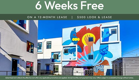 A colorful mural on a building with a sign offering a 6 weeks free on a 12-month lease.