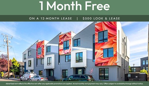 A building with a sign offering a free month on a 12-month lease.