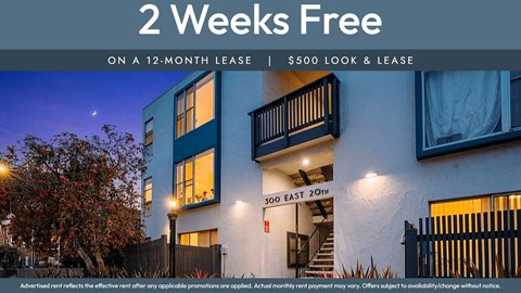 A building with a sign offering 2 weeks free on a 12-month lease.