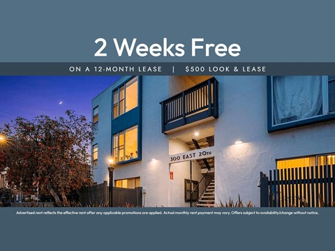 A building with a sign offering a 2 weeks free on a 12-month lease.