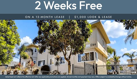 A house with a sign offering 2 weeks free on a 12-month lease.