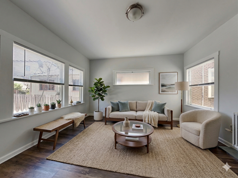 A living room with a couch, chair, and coffee table.