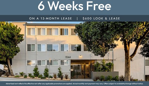 A building with a sign that says "6 Weeks Free on a 13-month lease | $600 look & lease".