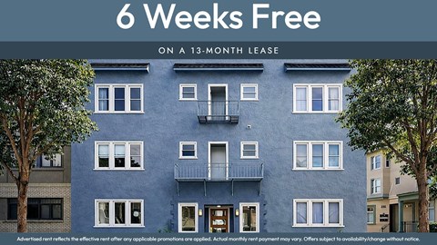 A blue building with the text "6 Weeks Free on a 13-month lease" displayed on it.