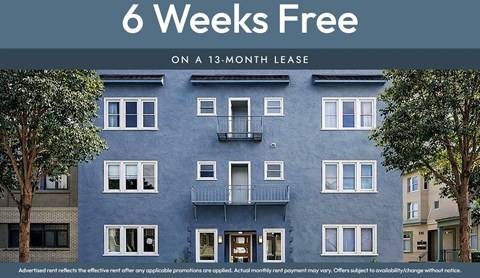 A blue apartment building with a sign that says "6 Weeks Free on a 13-month lease".