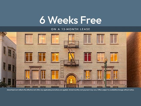 A building with a sign that says "6 Weeks Free on a 13-month lease".