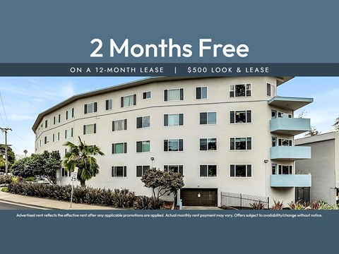 A white building with a sign offering 2 months free on a 12-month lease.