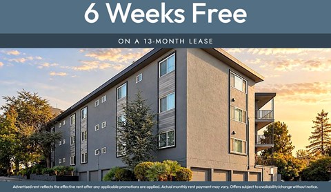 A building with the text "6 Weeks Free on a 13-month lease" in front of it.
