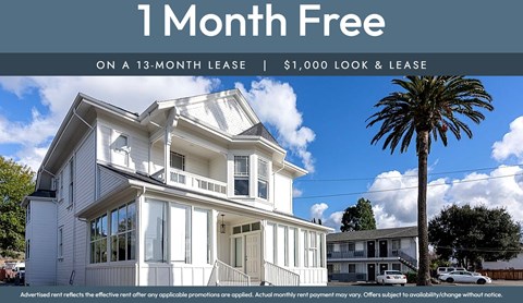 A house with a sign offering a free month on a 13-month lease.