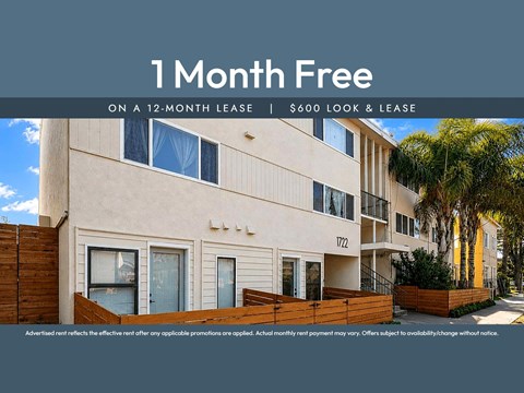 A building with a sign that says "1 Month Free on a 12-month lease | $600 look & lease".