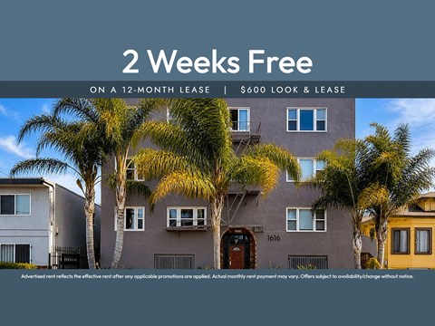 A building with a sign that says "2 Weeks Free on a 12-month lease | $600 look & lease".