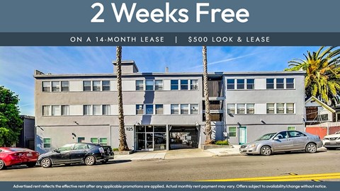 A building with a sign offering a 2 weeks free on a 14-month lease.