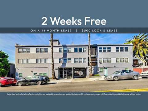 A building with a sign offering a 2 weeks free on a 14-month lease.