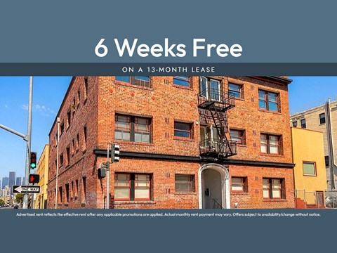 A red brick building with a black fire escape.