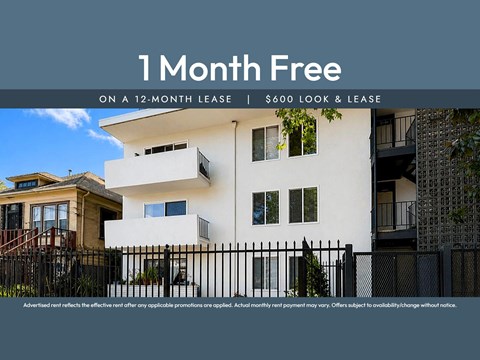 Apartment complex with a sign offering a free month on a 12-month lease.