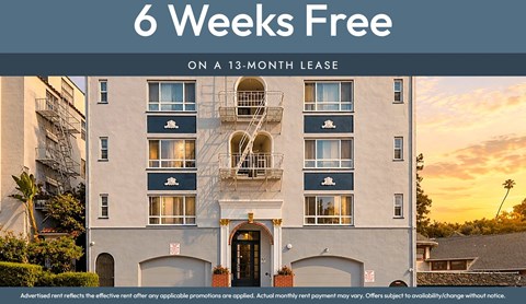 A building with a sign that says "6 Weeks Free on a 13-month lease".