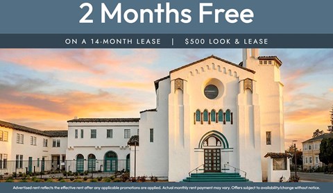 A white building with a green door and a sign that says "2 Months Free on a 14-month lease | $500 look & lease".