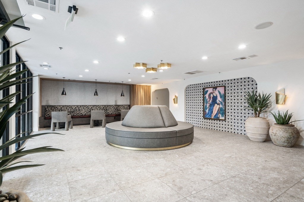 clubroom with a seating area and a round couch