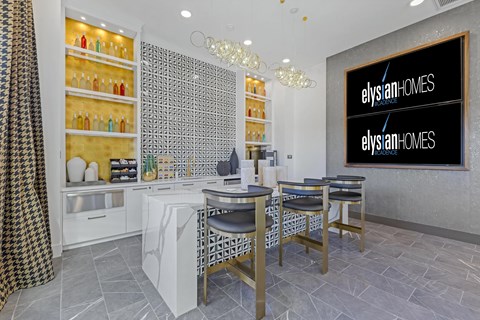 A modern kitchen with a dining table and chairs.